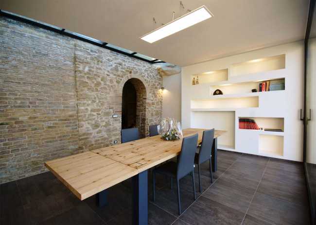 Interior of a house with a stone wall